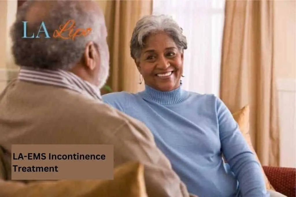 Couple sat smiling at each other - LA-EMS treatment Northampton